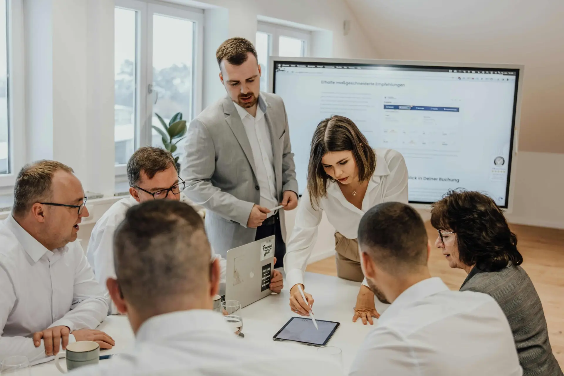 A group of workers in an office discussing Chane Management.