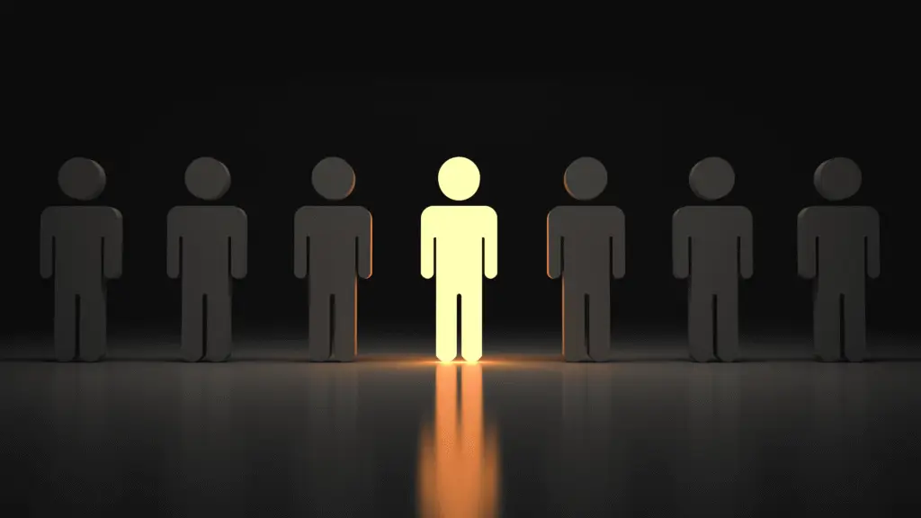 Focused business professional standing still among a blurred moving crowd, symbolising leadership focus, resilience, and clarity during continuous organisational change.